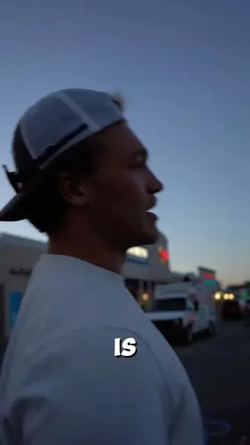 A person featured in a Breaking the Fast Instagram reel outside the kitchen