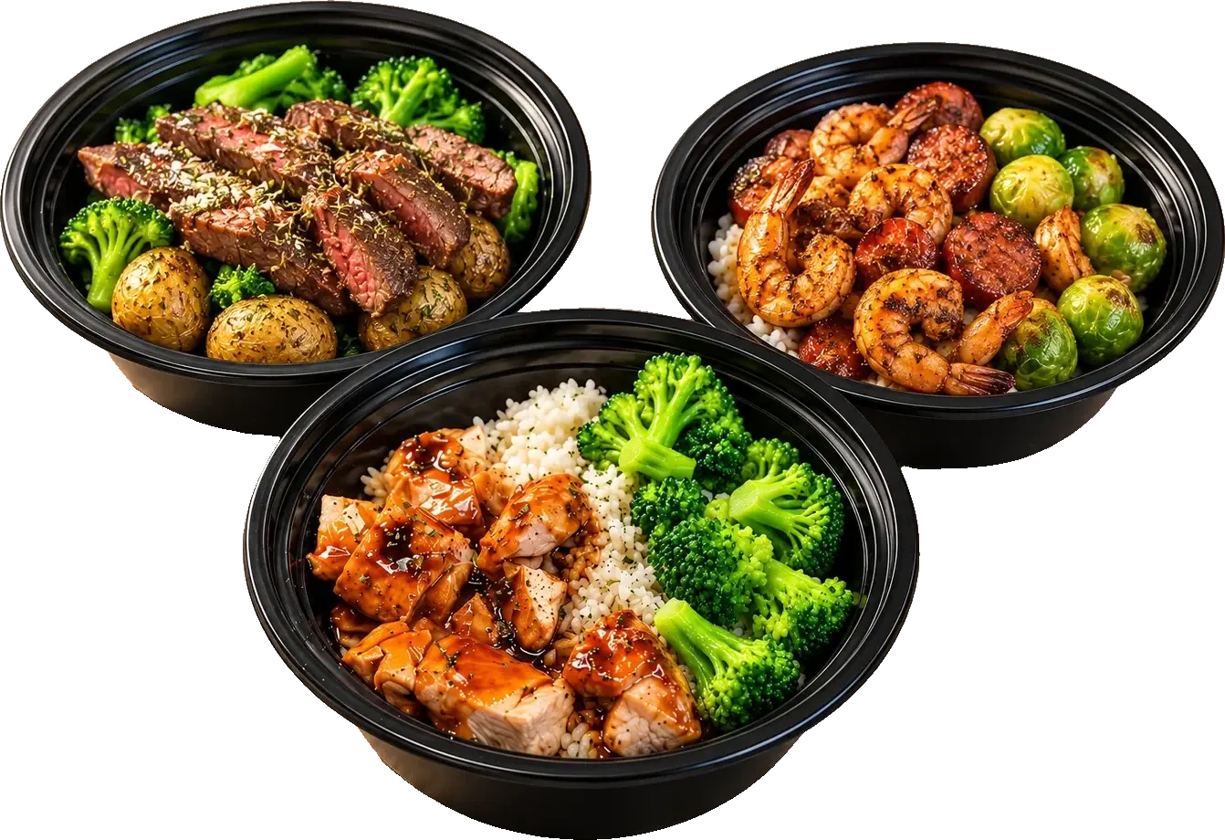 Breaking the Fast chicken, steak, and shrimp meals in black meal prep bowls